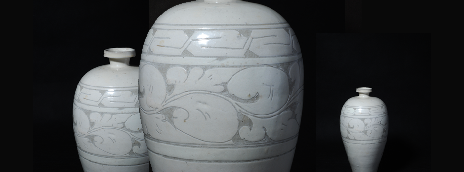  White glazed plum vase incised with flower pattern produced by Cizhou Kiln. H:32cm